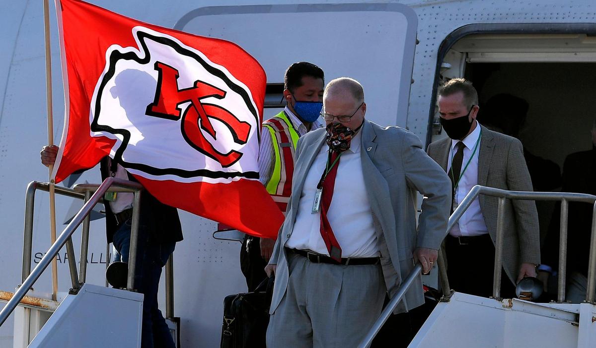 Kansas City Chiefs coach Andy Reid, front, and defensive coordinator Steve Spagnuolo were the first ones off the team plane that arrived late Saturday afternoon in Tampa, where they will take on the Tampa Bay Buccaneers in Super Bowl LV Sunday.