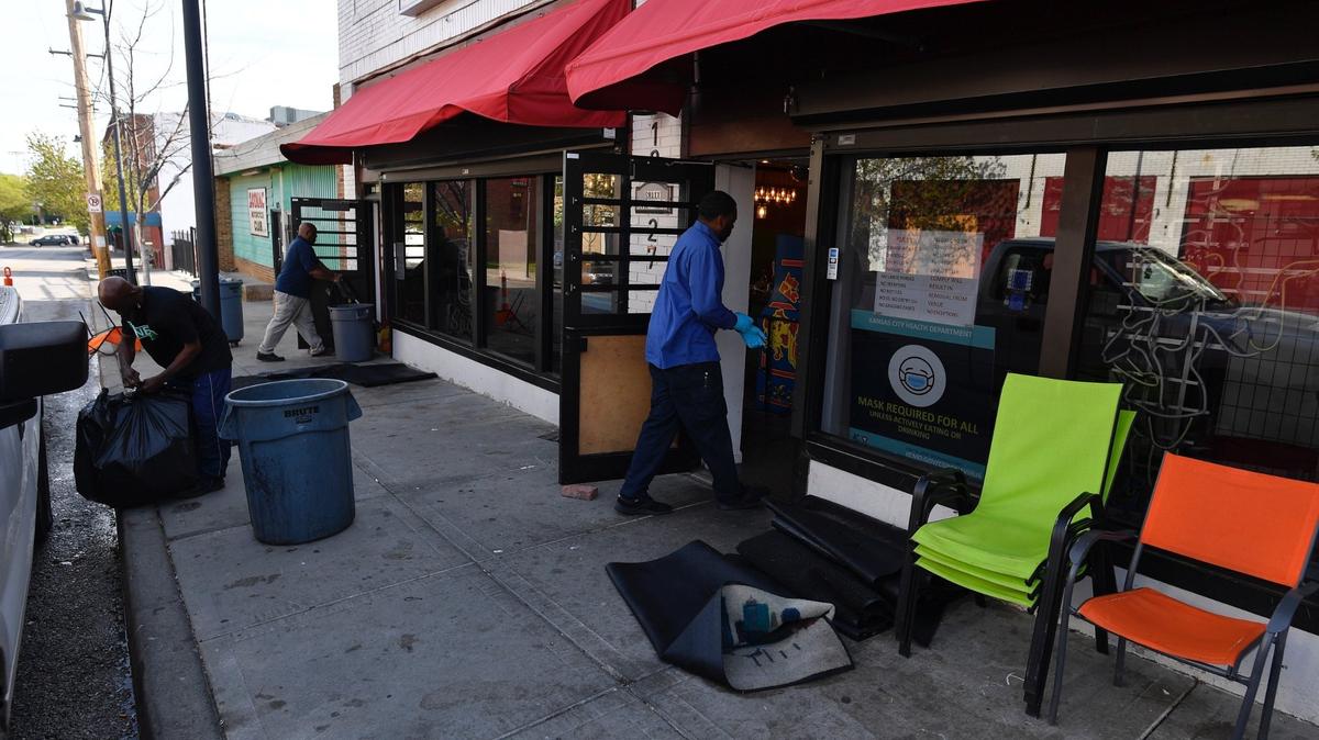 A cleaning crew was seen Monday in the historic 18th & Vine district in Kansas City. Police said gunfire erupted Sunday in the historic district leaving one man dead and three other adults injured.