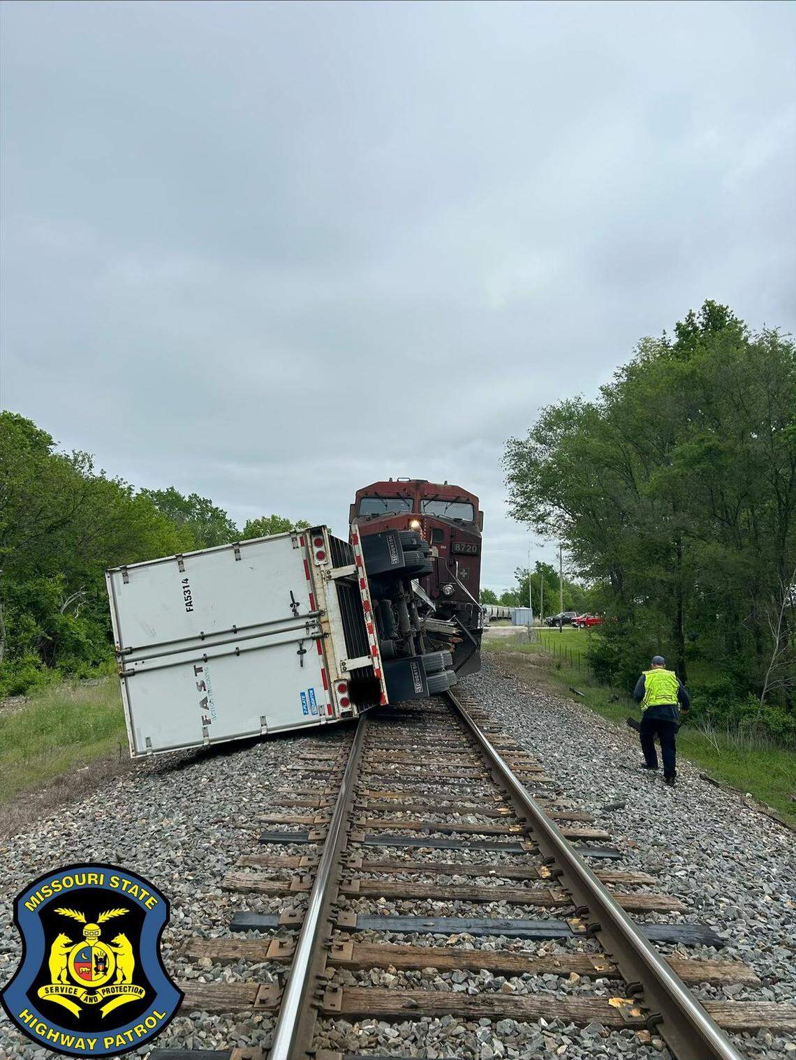 Part of a semi’s trailer was pushed about a half mile down the tracks after a collision at a rail crossing in rural Cass County Tuesday morning, according to the Missouri State Highway Patrol. The semi had become stuck while crossing the tracks at East 187th Street just east of South Holmes Road/Missouri Route D.