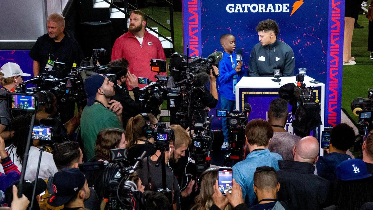 Kansas City Chiefs quarterback Patrick Mahomes listens to a question from NFL Network’s kid reporter Jeremiah Fennell during Super Bowl LVIII’s Opening Night event at Allegiant Stadium on Monday, Feb. 5, 2024, in Las Vegas.