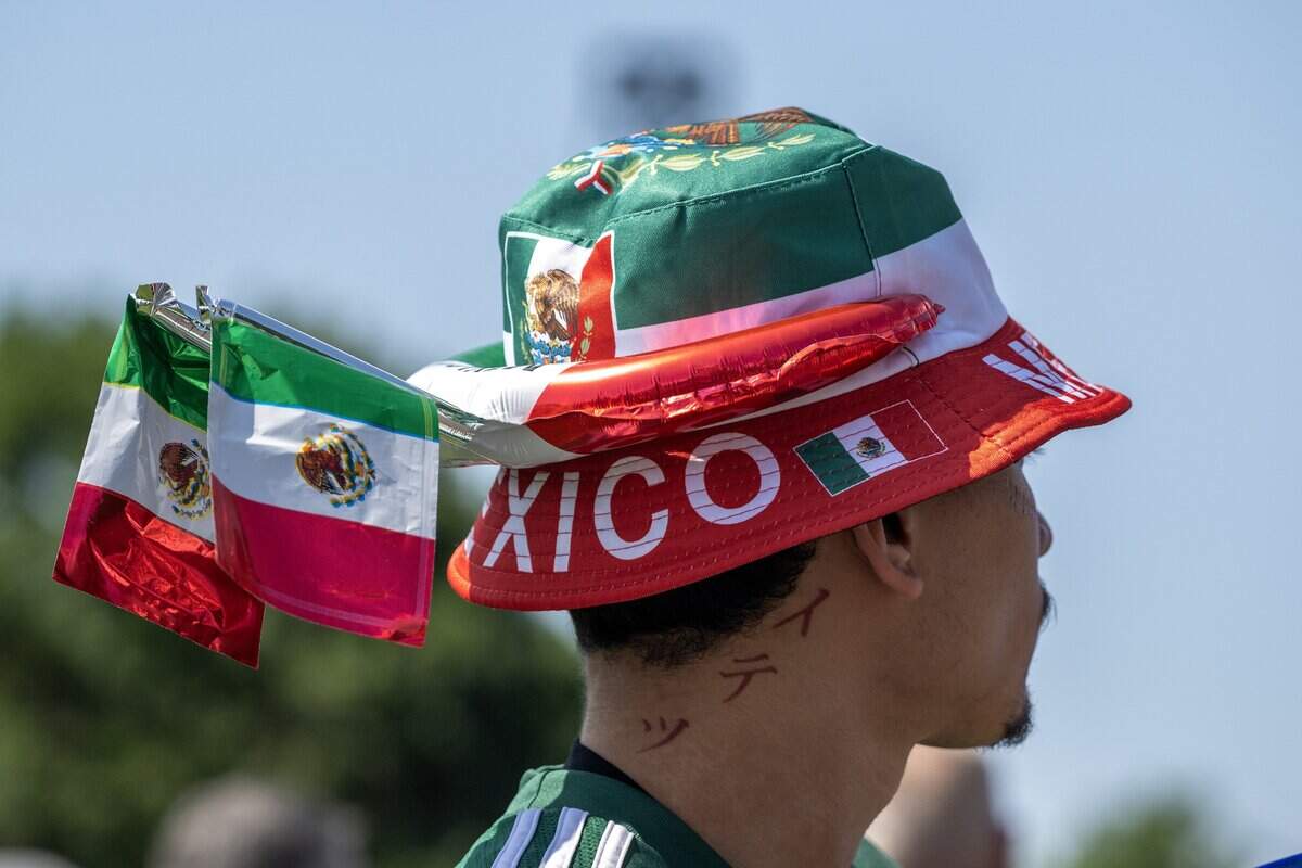 A fan wears a Mexico-themed bucket hat while attending the FIFA Fan Festival to watch Mexico play South Africa on Thursday, June 11, 2026, in Kansas City.