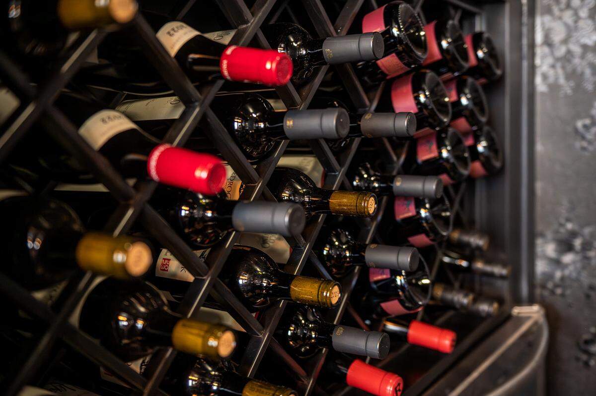 Wine bottles rest in a storage rack at Audrey's Wine + Bourbon on Thursday, Feb. 5, 2026, in the Waldo neighborhood of Kansas City.