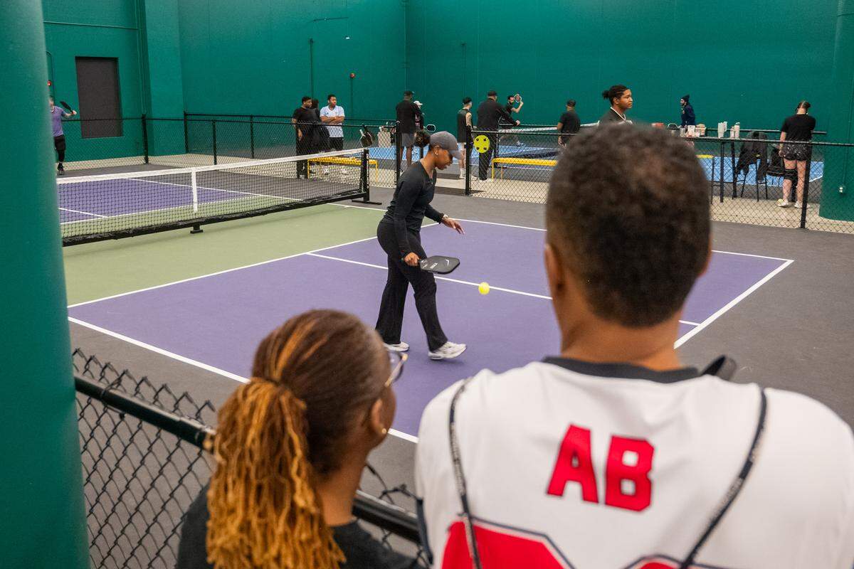 A meeting of the Black Pickleball Club at SW19 at the Stadium, on Sunday, Feb. 22, in Kansas City. Started by Brandan Jackson, the club was created as way to make the community feel welcoming and accessible to Black people interested in playing the sport.