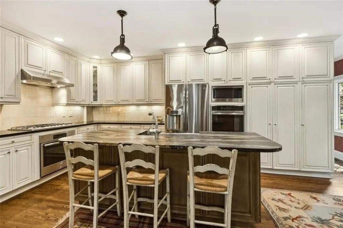 The kitchen inside of 434 W. 56th St. includes several stainless steel appliances.