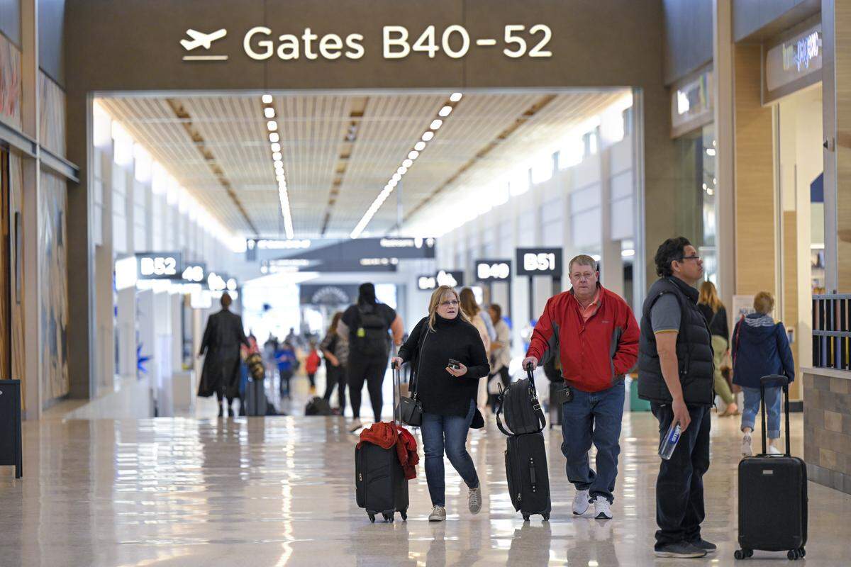 Passengers walked to their departure gates at the new $1.5 billion single terminal at Kansas City International Airport on Tuesday, Feb. 28, 2023.
