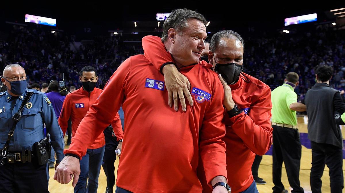 Kansas men’s basketball coach Bill Self (left) is embraced by assistant coach Kurtis Townsend after the Jayhawks beat rival Kansas State 78-75 in early 2022 at Bramlage Coliseum in Manhattan.
