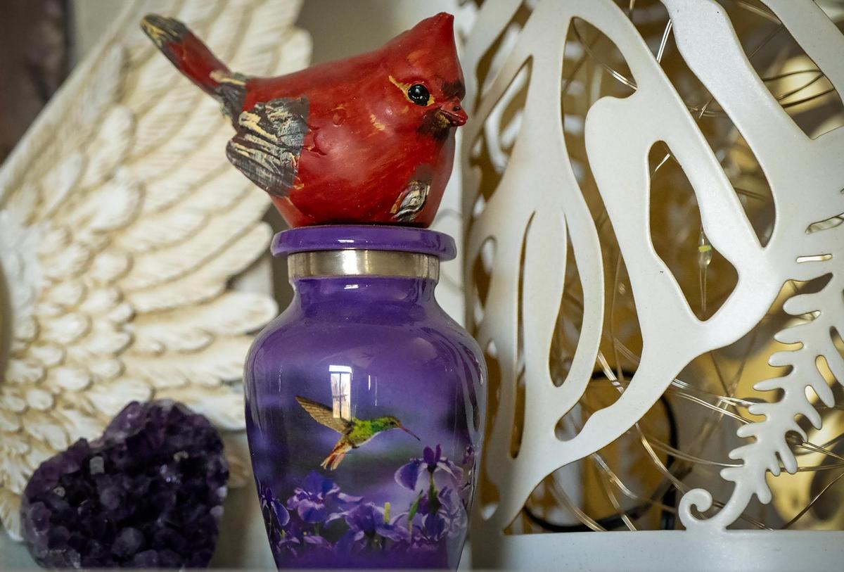 A miniature urn holds cremains of Gwen Starkey and sits on the mantle at the home of her daughter April Shaver.