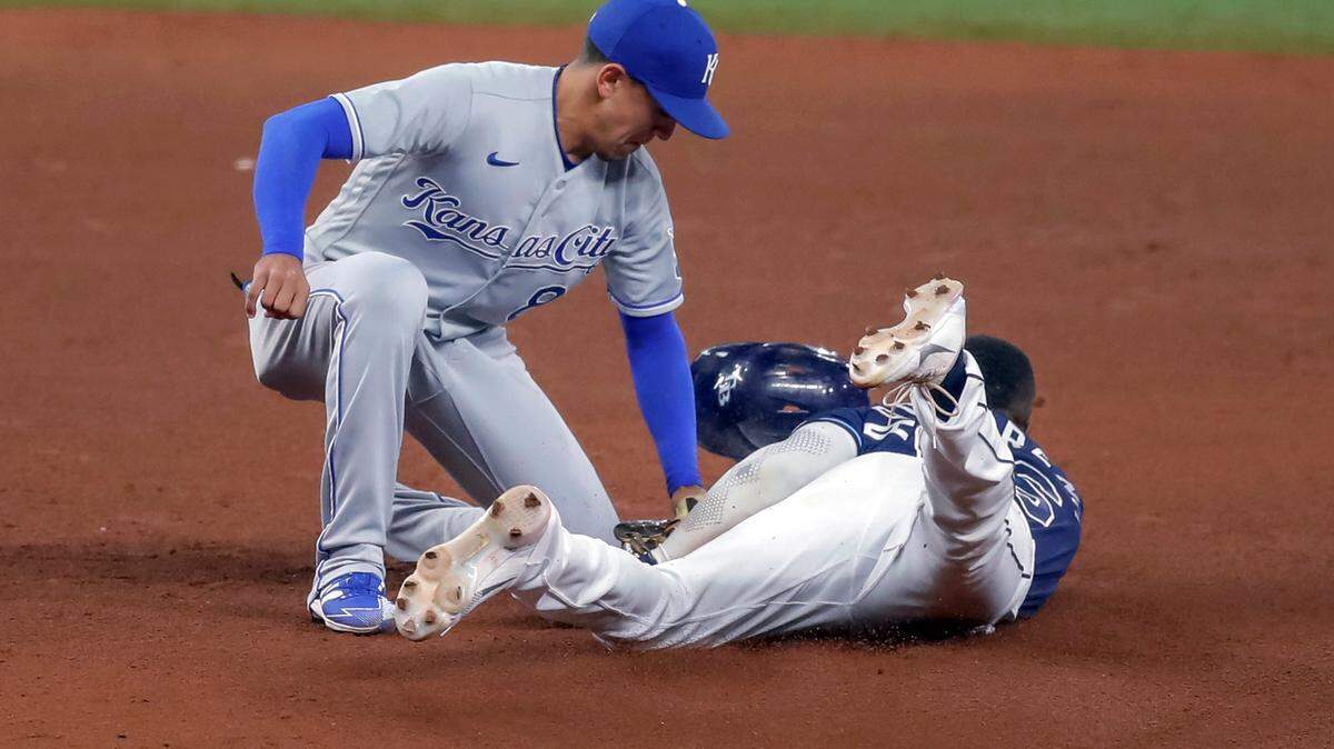 Kansas City Royals second baseman Nicky Lopez tags out Tampa Bay Rays’ Randy Arozarena on an attempted steal of second base during the fifth inning of a baseball game Wednesday, May 26, 2021, in St. Petersburg, Fla. (AP Photo/Mike Carlson)