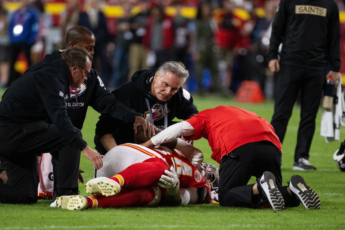 Kansas City Chiefs offensive tackle Wanya Morris grabs his knee after an injury on a play against the New Orleans Saints on Monday, Oct. 7, 2024, at GEHA Field at Arrowhead Stadium.