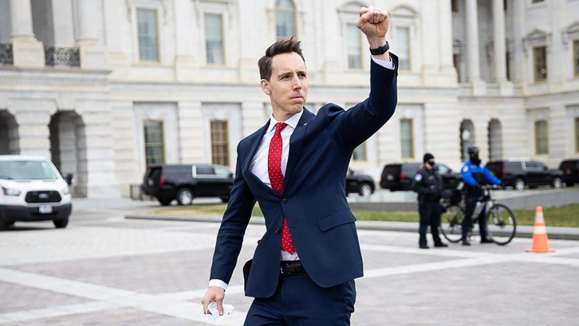 U.S. Sen. Josh Hawley of Missouri raised a fist of support to a crowd gathered at the U.S. Capitol to protest certification of President-elect Joe Biden’s win on Wednesday, Jan. 6, 2021.