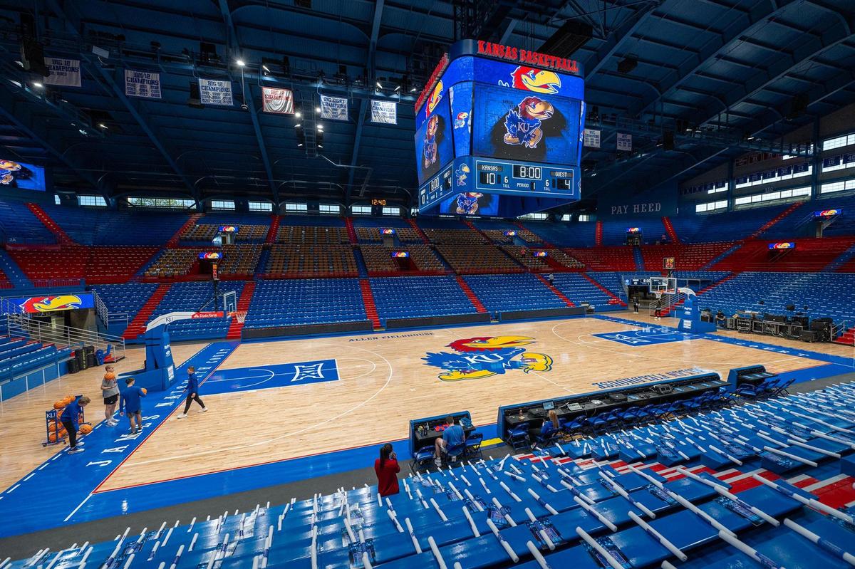 A new hardwood, playing court with a lighter finish and updated graphics, as well as a new state of the art center-hung video board, are among the renovations to Allen Fieldhouse in Lawrence. The video board is over 9 feet high and 18 feet wide.