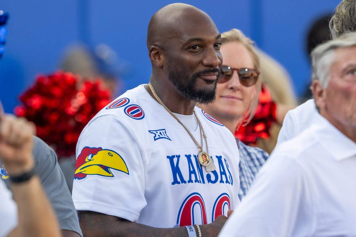 Former Kansas Jayhawks Aqib Talib stands on the sideline before the start of the Jayhawks game vs. the Fresno State Bulldogs on Saturday, Aug. 23, 2025, at David Booth Kansas Memorial Stadium, in Lawrence.