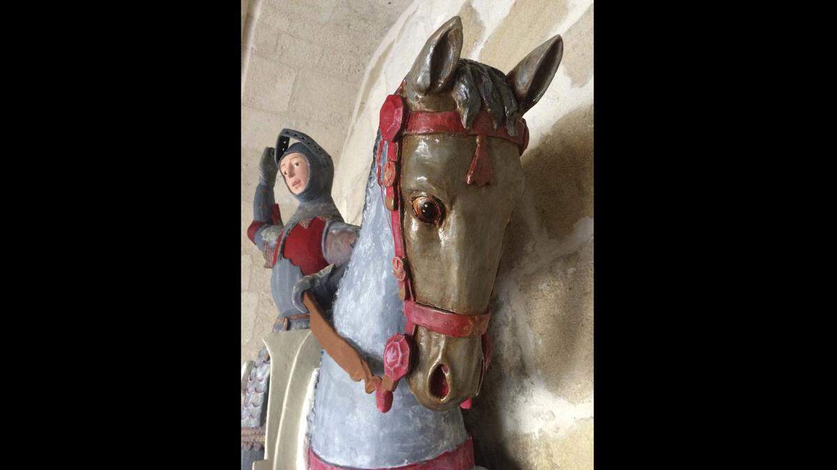 In this handout photo provided by ArtUs on Wednesday, June 27, 2018, a view of the 16th-century wooden figure of St. George, at St. Michael's Church in Estella, northern Spain, after its restoration. Spanish conservationists are outraged over what they say is yet another botched restoration of a historic work of art.