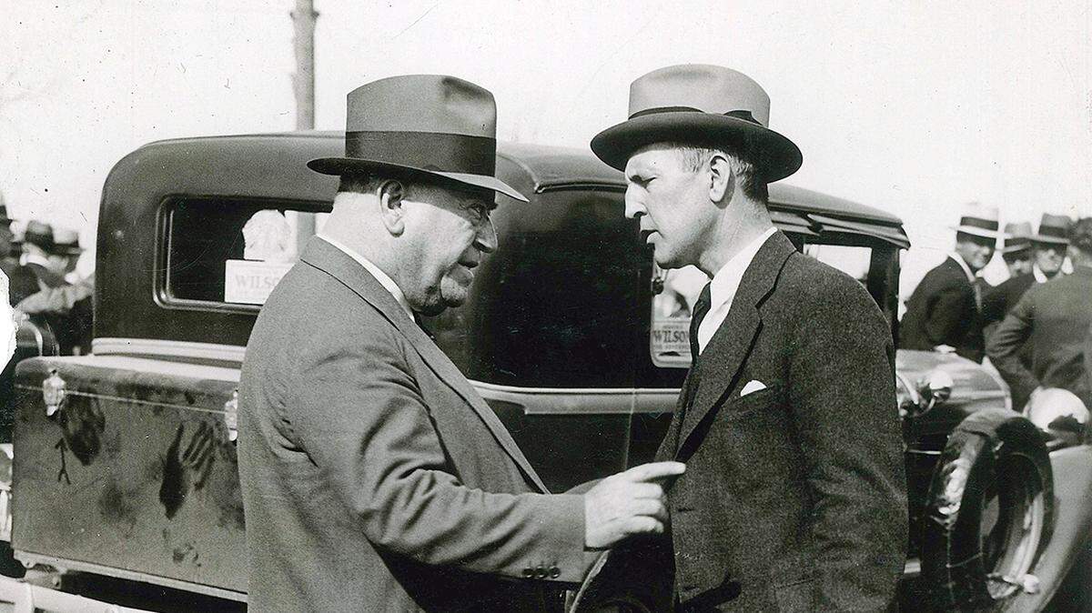“Boss” Tom Pendergast (left) speaks to Lloyd Crow Stark at the funeral of Francis M. Wilson in Platte City in 1932.