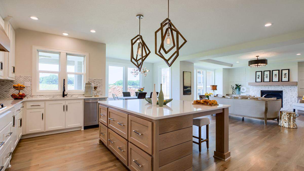 In Red Fox Run at Sundance Ridge—located east of Mission Road on 175th Street—Rodrock Homes’ Lancaster showcases form, function, and finesse and is open to tour 7 days a week. The home offers a spacious layout with formal dining and center-island kitchen that overlooks the expansive great room.