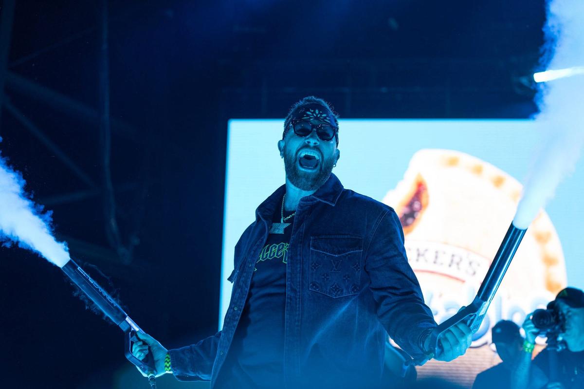 Kansas City Chiefs tight end Travis Kelce fires up the crowd with air guns during Kelce Jam at the Azura Amphitheater on Saturday, May 18, 2024, in Bonner Springs, Kansas.