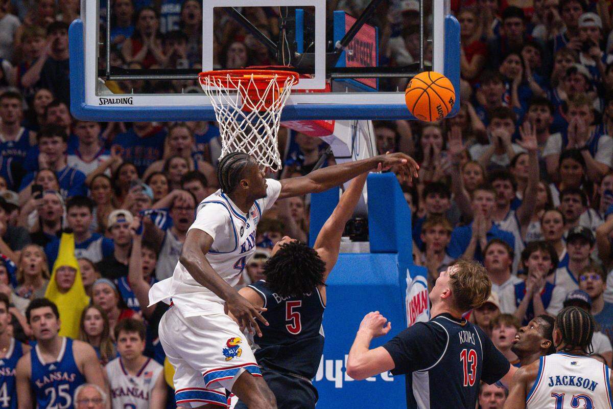 Kansas Jayhawks forward Flory Bidunga (40) blocks the shot of Arizona Wildcats guard Brayden Burries (5) late in the second half on Monday, February 9, 2026, at Allen Fieldhouse.