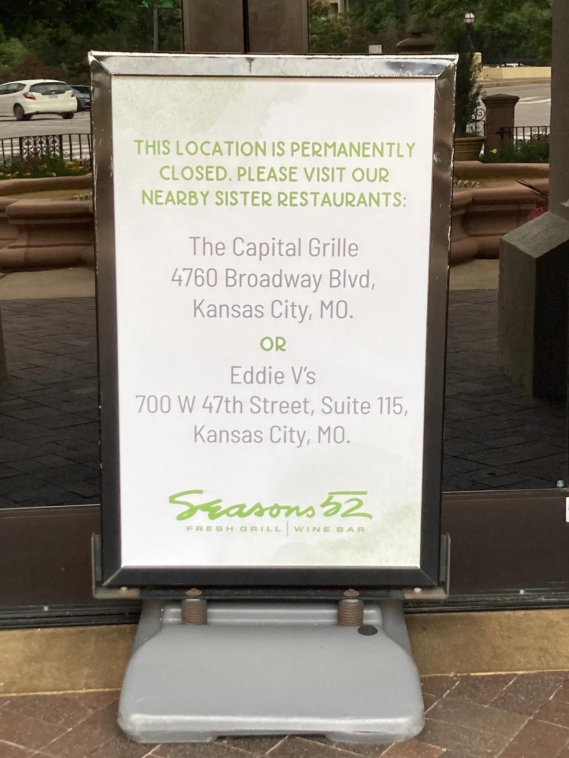 A sign at the entrance to Seasons 52 on the Country Club Plaza announces its sudden closing in May.
