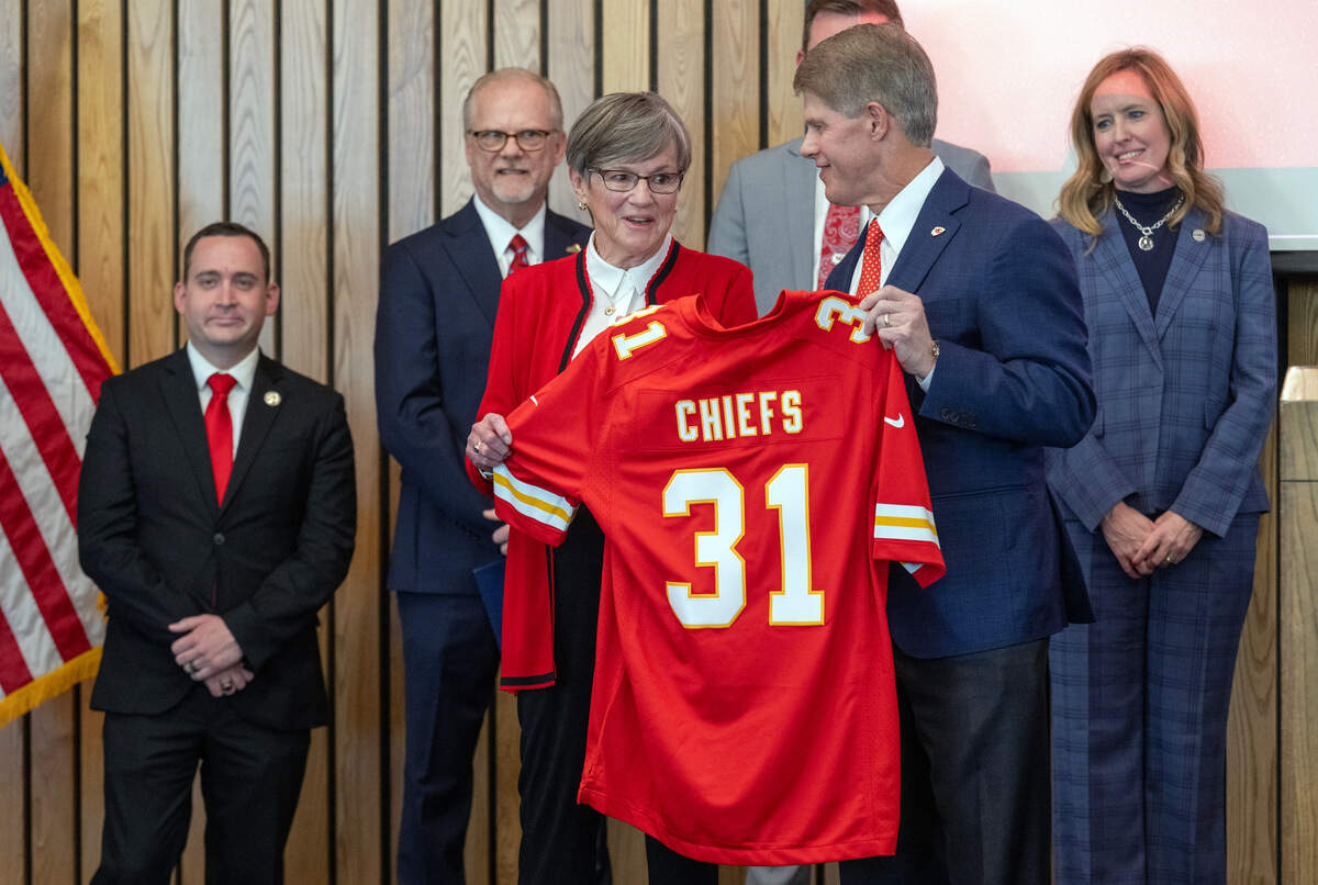 Kansas Governor Laura Kelly announced Monday, Dec. 22, 2025, in Topeka that the Kansas City Chiefs will build their new stadium in Kansas City, Kansas. Kelly presented Chiefs CEO Clark Hunt with a jersey as others looked on during the announcement. 2031 signifies the year the Chiefs will begin playing in Kansas.