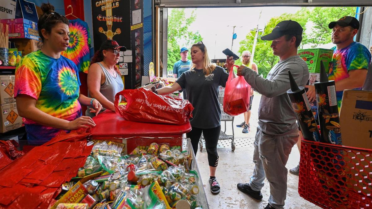 Cashiers Ashley Freeman, left, and Shawna Burns rang up customers orders as they were buying sparklers, mortar shells and other fireworks in 2021 in Jackson County.