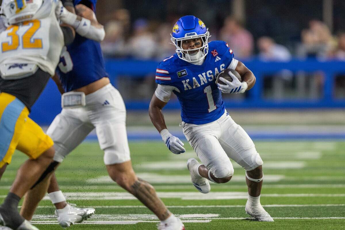 Kansas Jayhawks running back Dylan Edwards (1) attempts to turn the corner in the first half of the Jayhawks game vs. Long Island University Sharks at David Booth Memorial Stadium on Friday, September 4, 2026, in Lawrence.