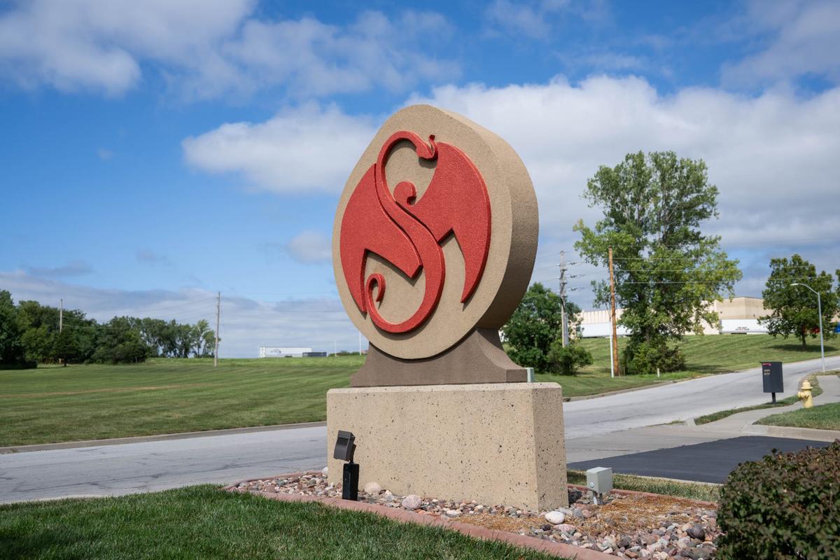 The serpent and bat logo the represents Strange Music stands at the entrance to the music label’s Kansas City headquarters.