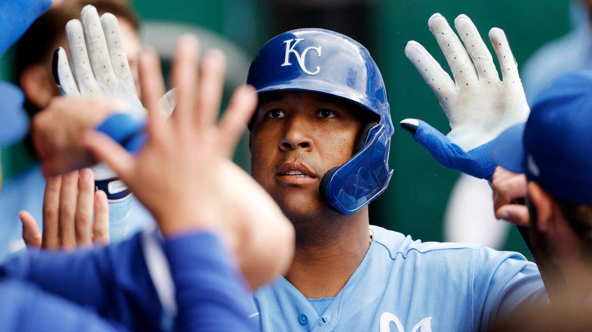 Kansas City Royals’ Salvador Perez celebrates in the dugout with his teammates after hitting a two-run homerun during the sixth inning of a baseball game against the Houston Astros in Kansas City, Mo., Saturday, June 4, 2022. (AP Photo/Colin E. Braley)