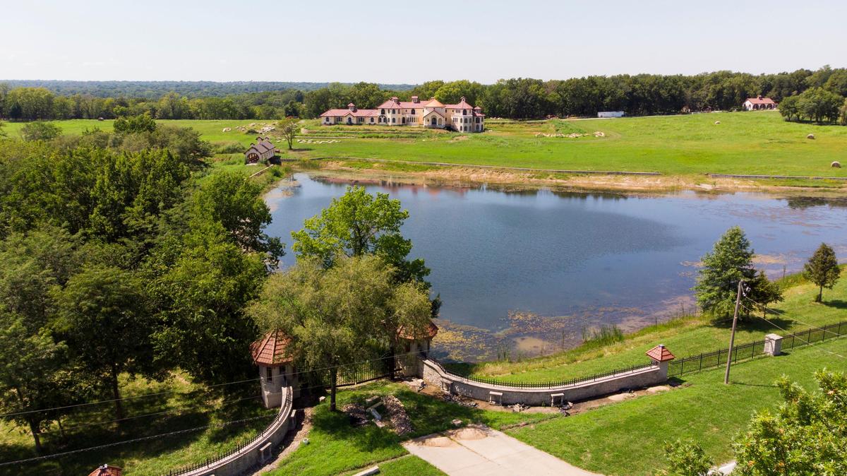 In addition to the mansion under construction, the 96-acre property includes a pond, a covered bridge and a Civil War burial ground.