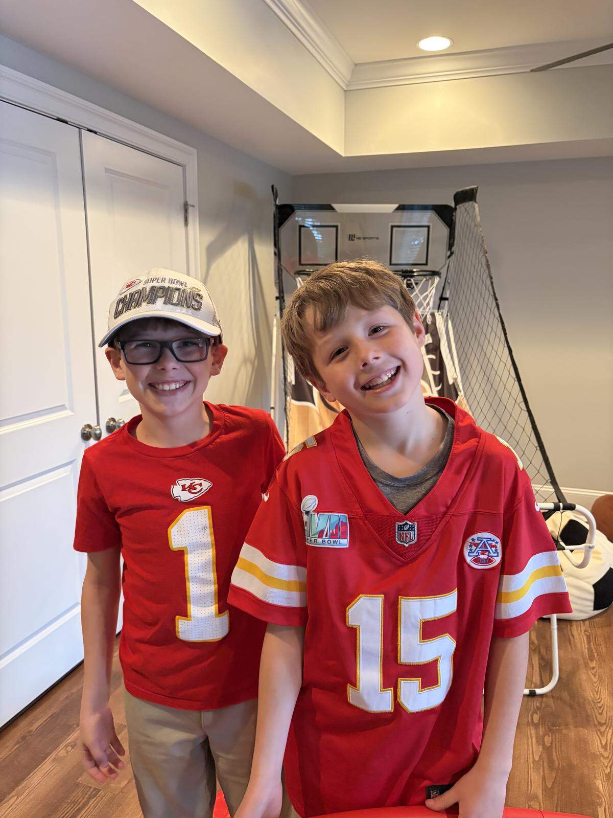 Brody (left) and Briggs Kilpatrick are Chiefs fans, glued to the TV along with their father, Matt.