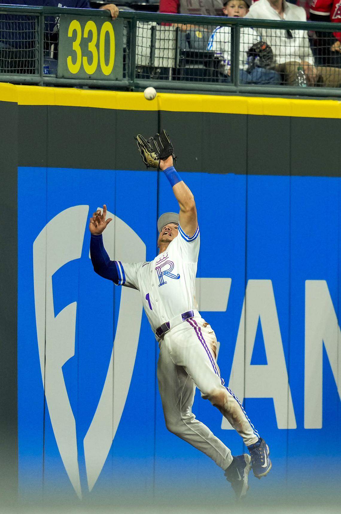Royals outfielder Isaac Collins makes a leaping catch at the wall during KC’s 6-3 defeat of the L.A. Angels at Kauffman Stadium in Kansas City on Friday, April 24, 2026.