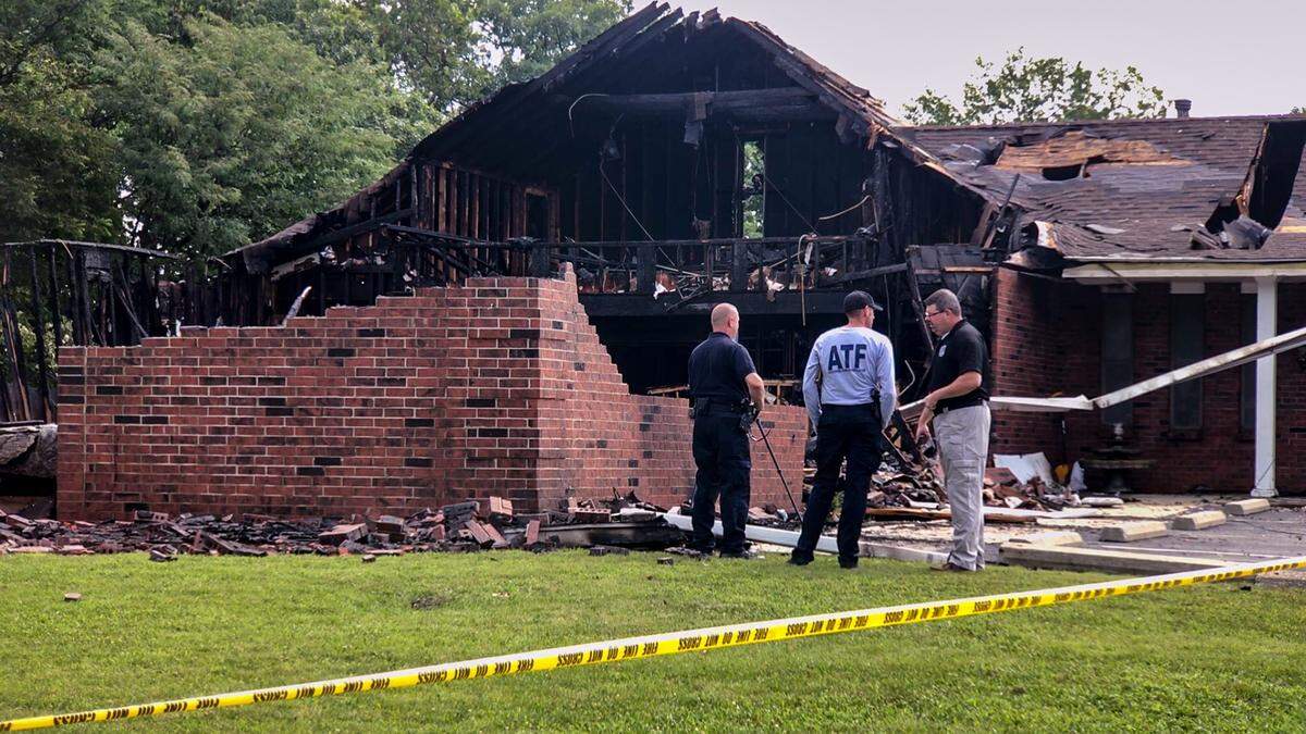 Investigators from the U.S. Bureau of Alcohol, Tobacco, Firearms and Explosives, the Kansas Fire Marshal’s office and Kansas City, Kansas, Fire Department investigate the cause of a fire that destroyed the Wyandotte Tabernacle church early Sunday.