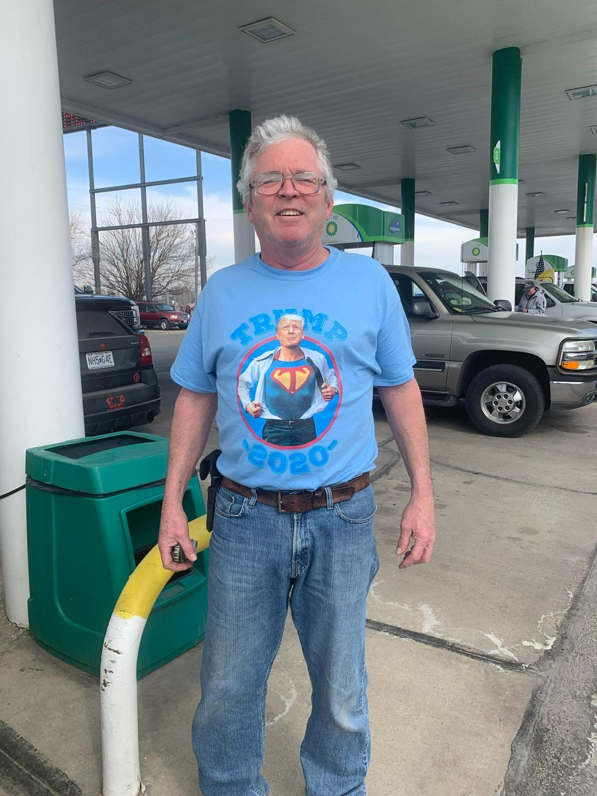 Jeff Davidson, of Oskaloosa, Kansas, filled up his camper van in Oak Grove, Missouri Friday while participating in the “Freedom Convoy.”