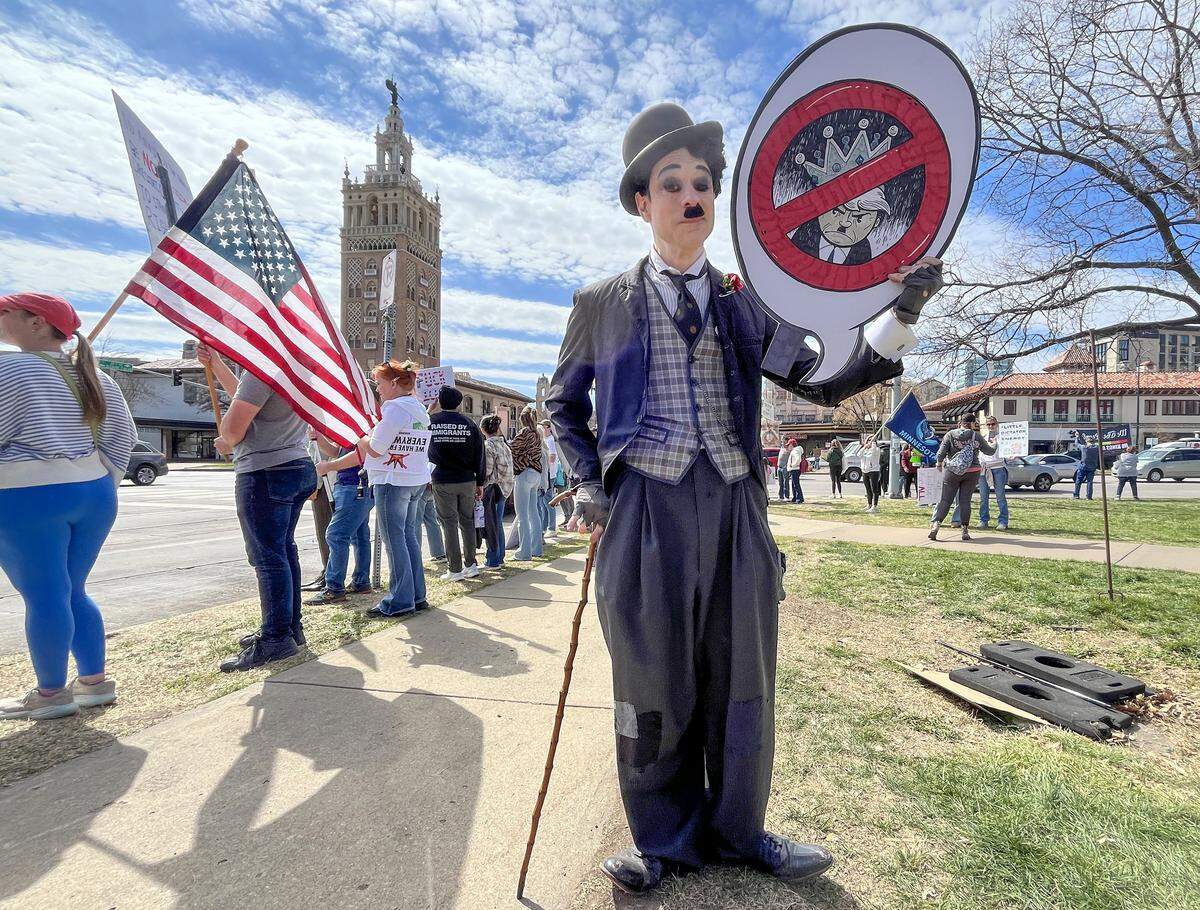Protesters gathered in Mill Creek Park near the Country Club Plaza on Saturday, March 28, 2026, for a No Kings protest against the Trump administration. It's the third round of No Kings protests that have swept the nation over the past year.