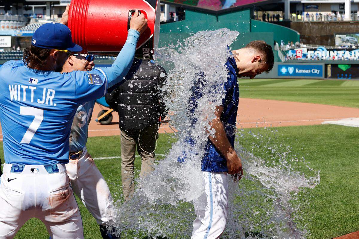 Royals pitcher Kris Bubic, right, gets an ice-bucket bath from teammate Bobby Witt Jr. after KC’s Major League Baseball victory over the Baltimore Orioles on Sunday, April 6, 2025, at Kauffman Stadium in Kansas City.