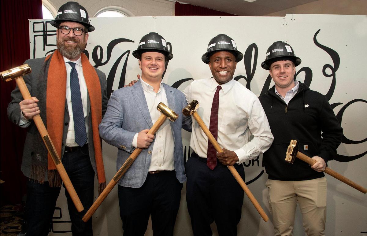 Jon Stephens of Port KC (left) Zach Molzer of Molzer Development, Kansas City Mayor Quinton Lucas and Max Schieble of Free Heel Capital, posed with sledge hammers Wednesday, January 22, 2025 at the Aladdin hotel ground breaking. The Aladdin, opened in 1925 and closed in 2022, is being converted into apartments and is scheduled to open in the Spring of 2026.