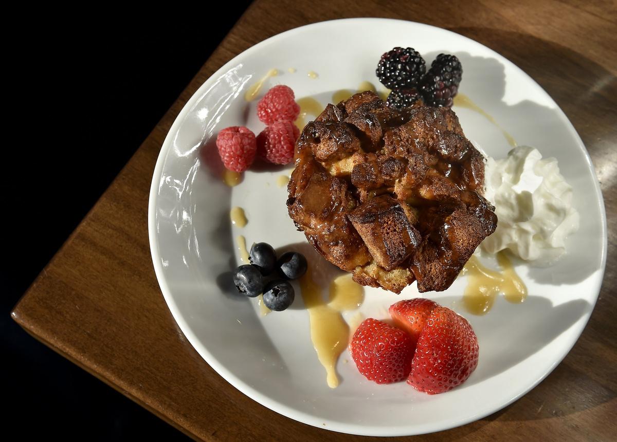 One of the Classic Cup Cafe’s breakfast offerings is the bread pudding with raisins and pecan and caramel sauce, fruit and whipped cream.