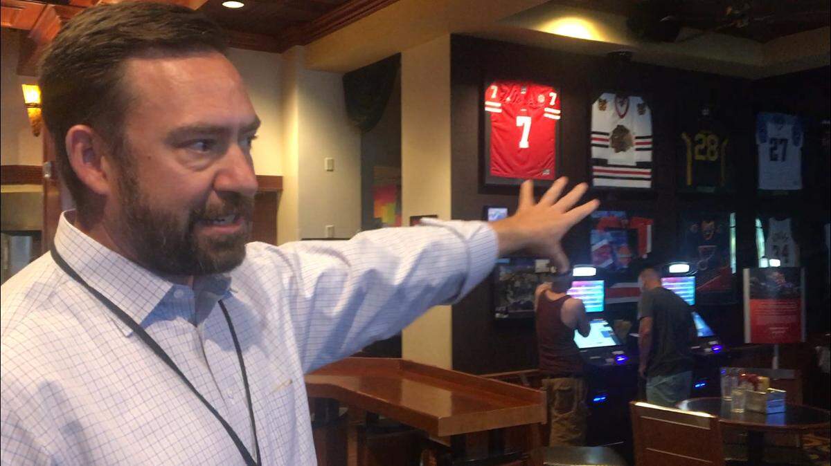 Paul Czak, Ameristar Council Bluffs (Iowa) vice president and general manager, displays the new sportsbook.