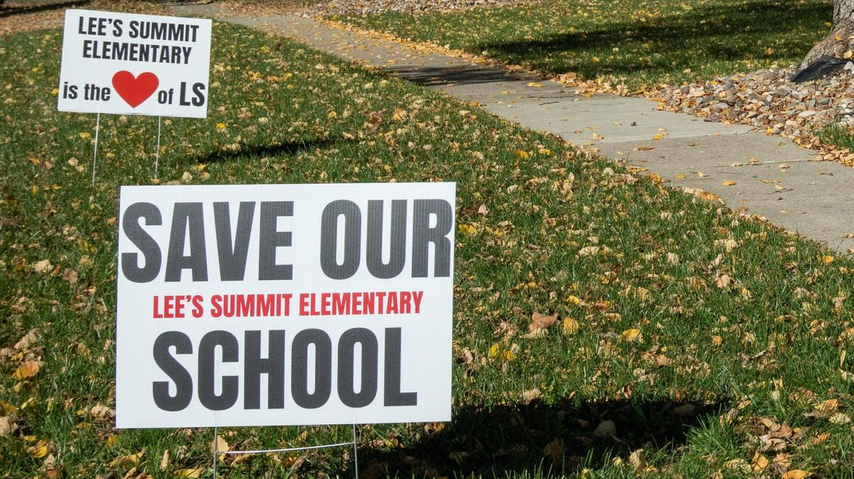 A yard displays signs in support of keeping Lee’s Summit Elementary School separate, Friday, Nov. 15, 2024. The school is being considered for consolidation.