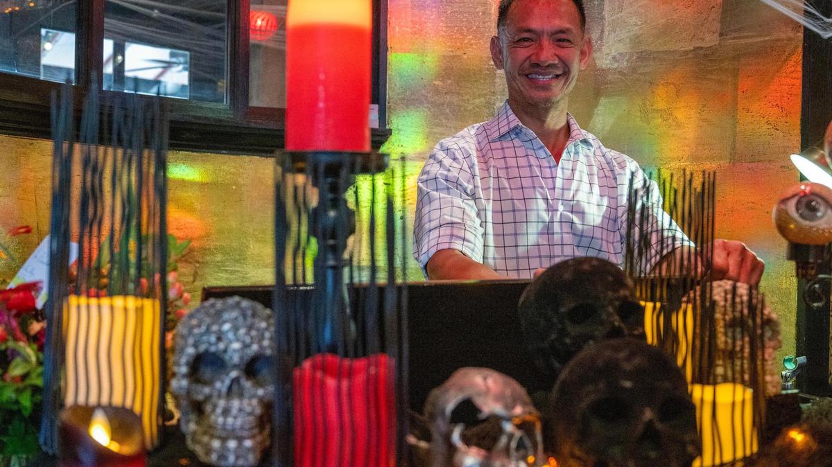 Tai Nguyen, co-owner of Cafe Trio, is getting his restaurant good and ready for Halloween.