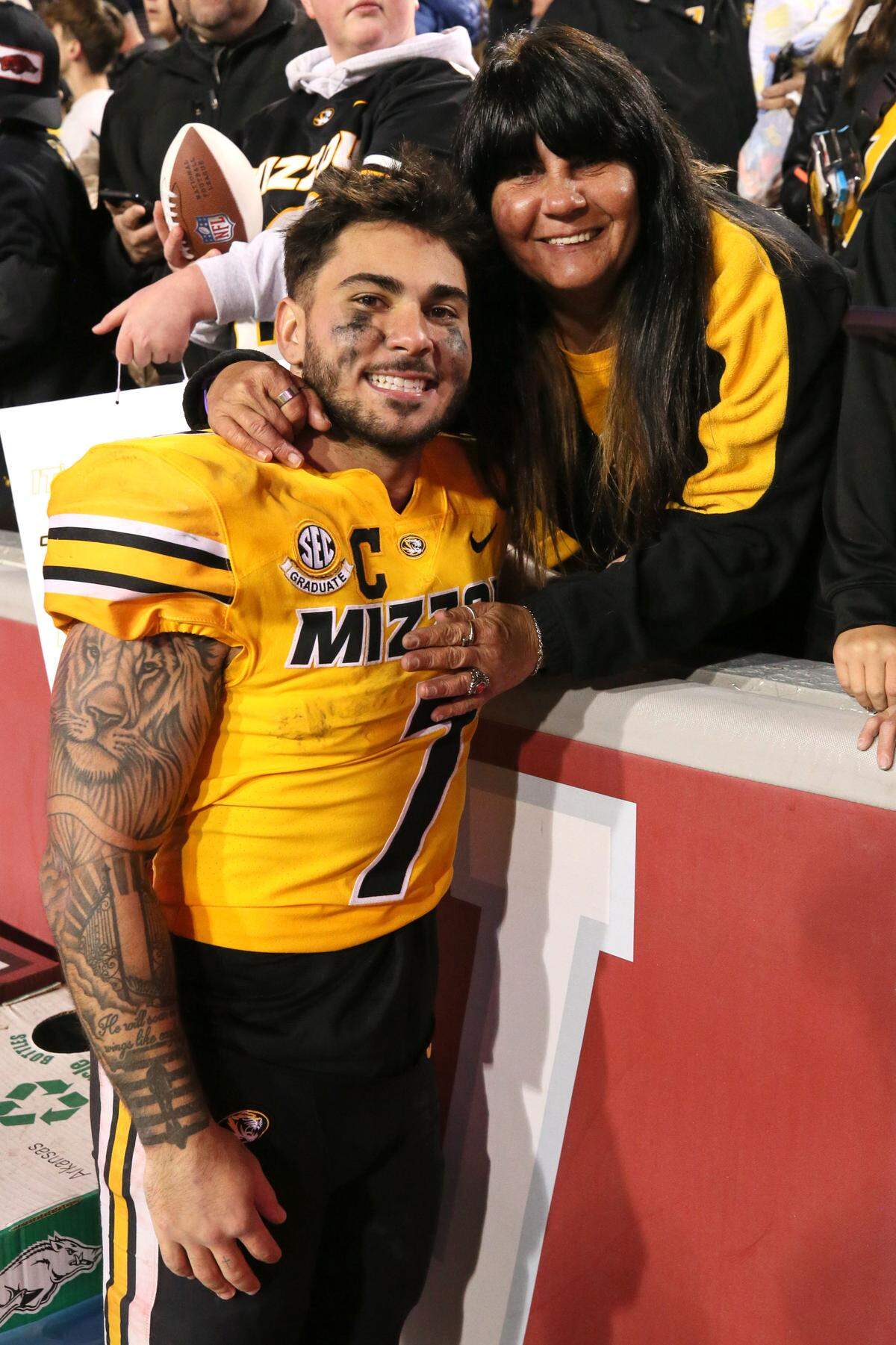 Tigers running back Cody Schrader poses with his mom after Friday’s 48-14 MU victory over the Arkansas Razorbacks at Donald W. Reynolds Razorback Stadium in Fayetteville, Ark.