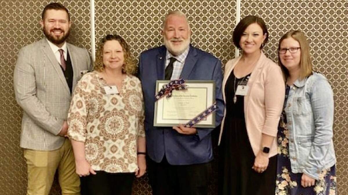 Greg Finch of Summit Christian Academy was recently named the National Society of the Daughters of the American Revolution “Outstanding Teacher of American History of 2022” for all Missouri schools, public and private. Sharing the honor with Finch was his family: From left is his son, Jonathan Finch, his wife, Pam Finch, Finch, his daughter Bethany Lee and his daughter Emily Parker.