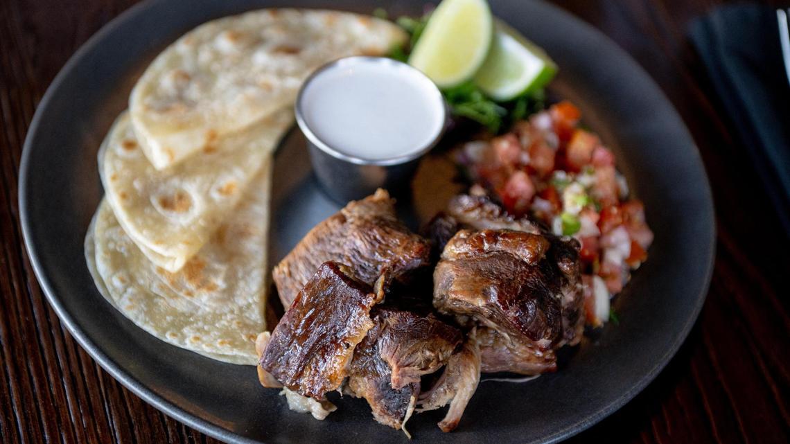 The smoked carnitas plate with pico de gallo, garlic crema and flour tortillas is on the menu at Barbacoa.
