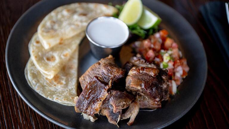 They love Kansas City BBQ and Mexican food. They combined them in this new restaurant