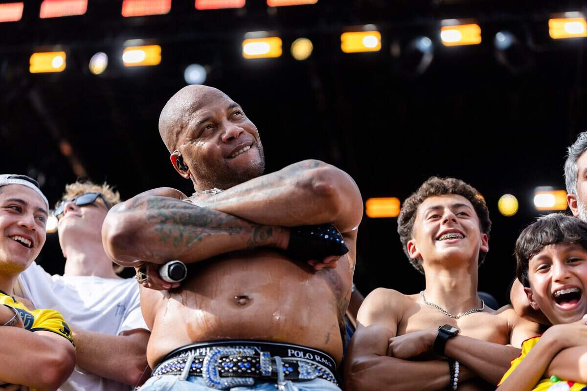 Flo Rida brings members of the crowd on stage and poses for a photo during their FIFA Fan Fest concert at Fan Fest on Friday, June 19, 2026.
