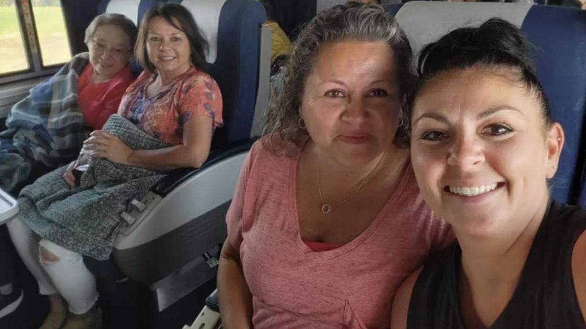 Rachelle Cook, 57, second from right, and her sister Kim Holsapple, 56, second from left, were among three Amtrak passengers killed in a train crash and derailment that occurred after the train struck a dump truck onJune 27, 2022 near Mendon, Missouri. On Tuesday, Cook’s family filed a wrongful death lawsuit against BNSF Railway and MS Contracting, the company that operated the truck.