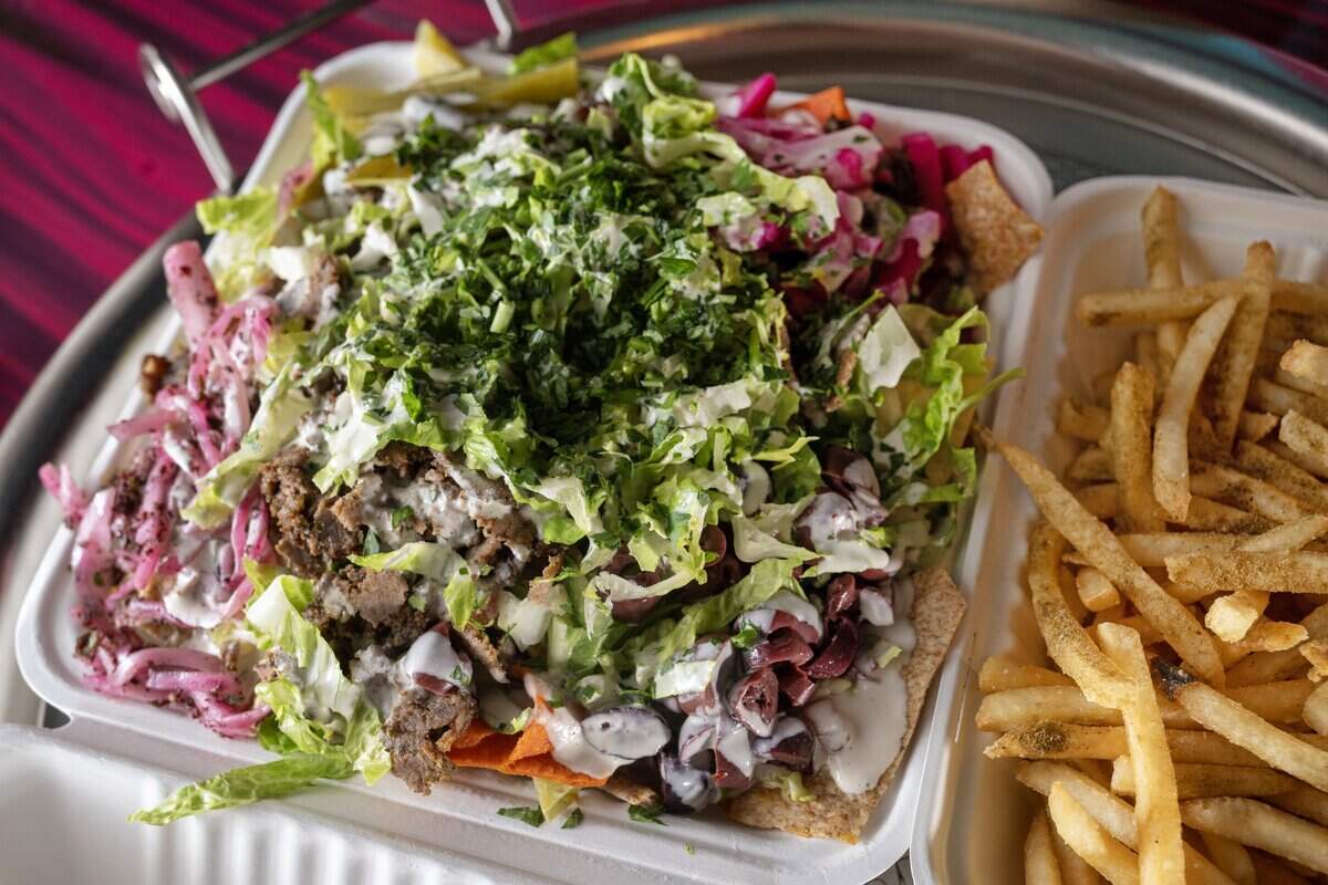 Beef nachos and a side order of French fries seasoned with Baba's signature spice, at Baba's Pantry, 1019 E. 63rd St., on Tuesday, May 19, 2026, in Kansas City.