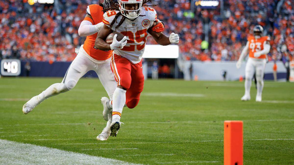 DENVER, COLORADO - NOVEMBER 16: Nik Bonitto #15 of the Denver Broncos pushes Kareem Hunt #29 of the Kansas City Chiefs out of bounds during the third quarter at Empower Field At Mile High on November 16, 2025 in Denver, Colorado. (Photo by Justin Edmonds/Getty Images)