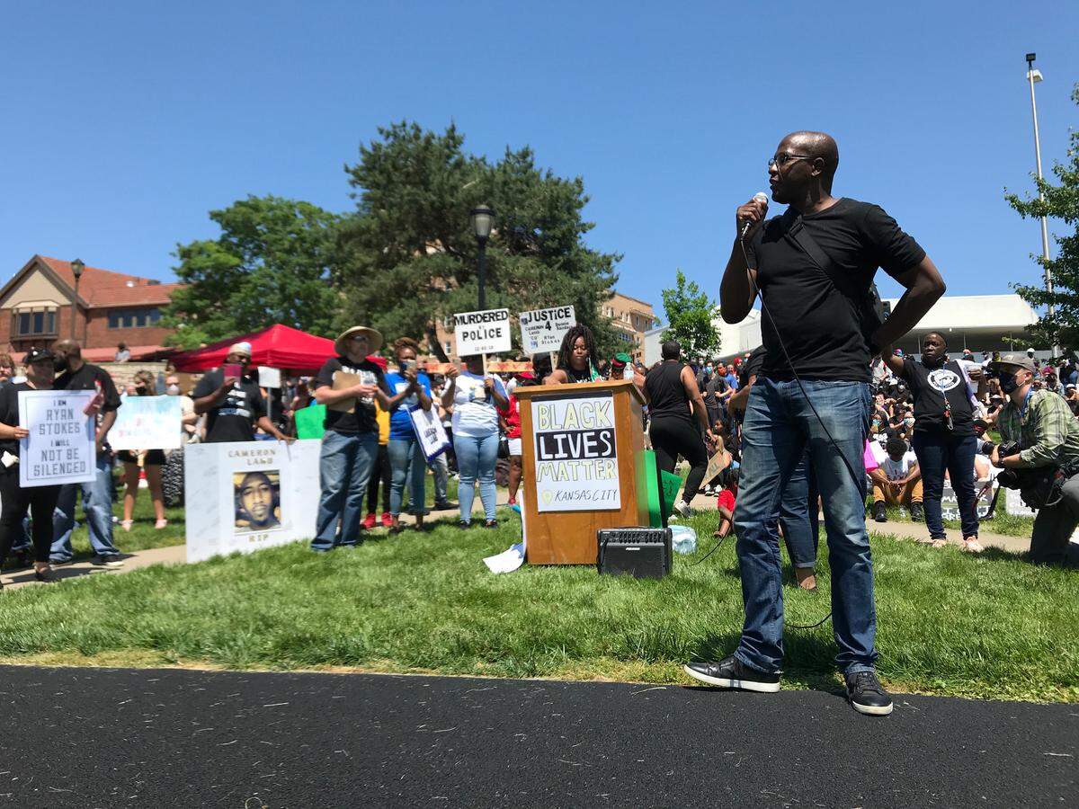 Henry C. Service, an attorney and protest organizer, spoke at a demonstration Sunday at the Country Club Plaza in Kansas City. 