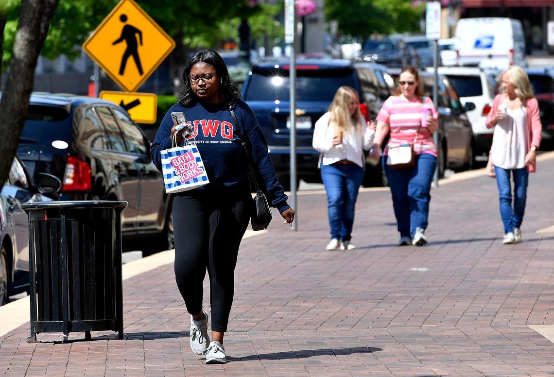 Shoppers on the Country Club Plaza could shed their masks and enjoy the spring weather as Mayor Quinton Lucas announced Friday the city is fully lifting its emergency order.