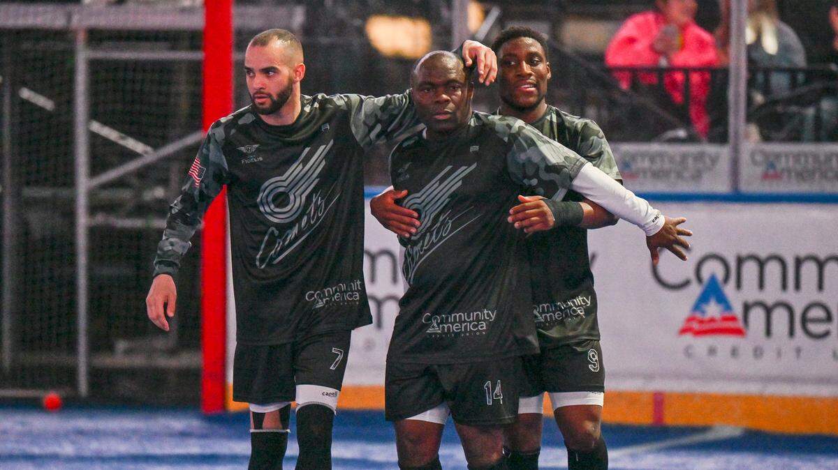 Leo Gibson (middle) celebrates his 300th regular-season goal with Kansas City Comets teammates Lucas Sousa (left) and Junior Kazeem.